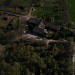 Aerial view of the Biskupin archaeological site in Poland, showcasing ancient village structures.