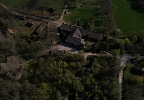 Aerial view of the Biskupin archaeological site in Poland, showcasing ancient village structures.